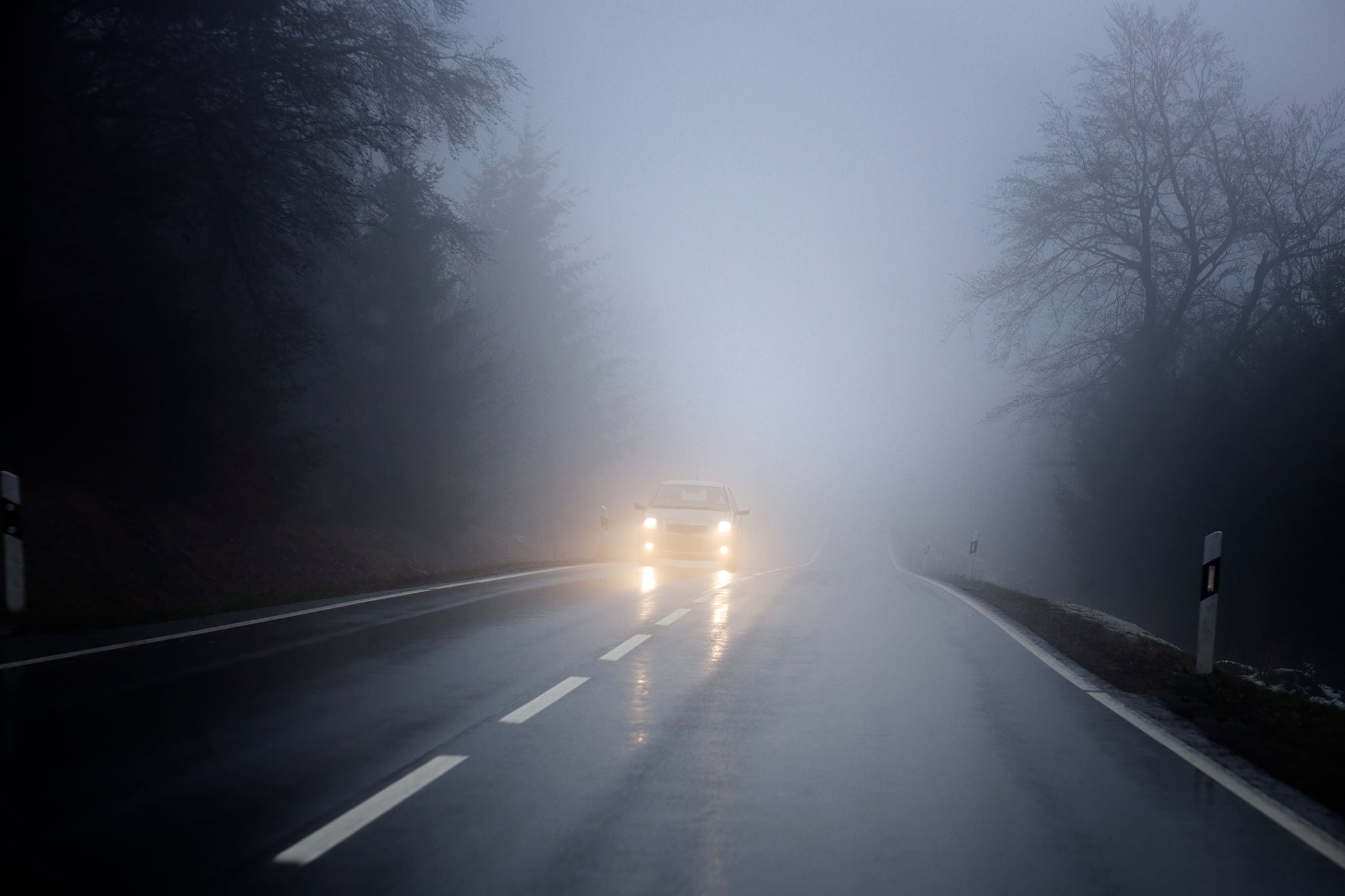 Uniroyal - Fog on the country road, oncoming traffic.