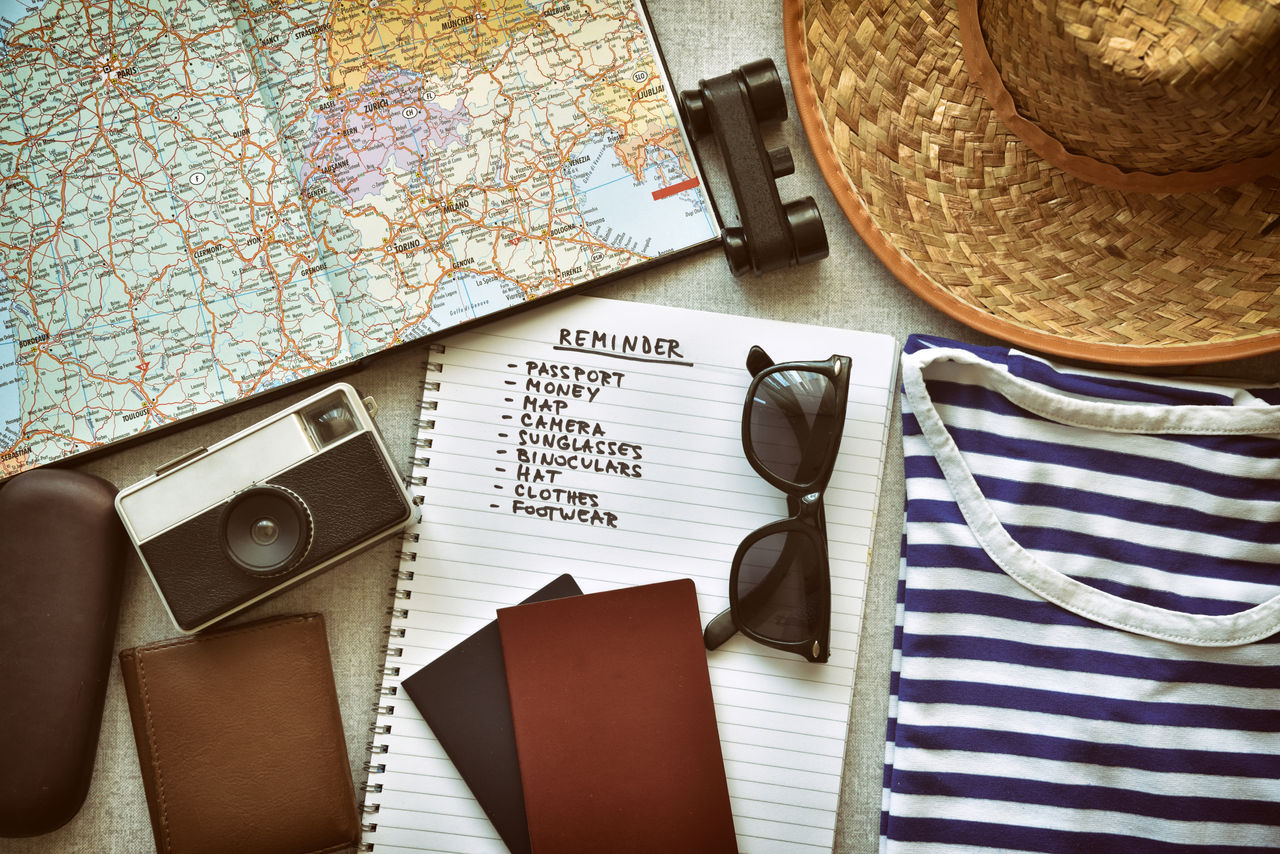 Uniroyal - Top view of traveler's accessories and travel checklist.