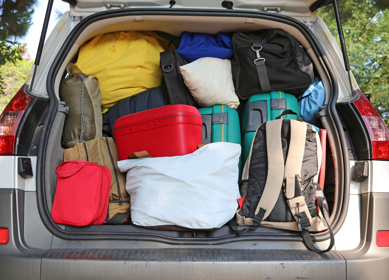 Uniroyal - car overloaded with suitcases and duffle bag for family travel